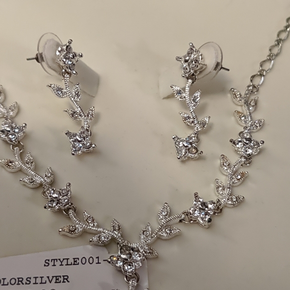 Silver floral necklace with matching earrings. - Picture 2 of 3